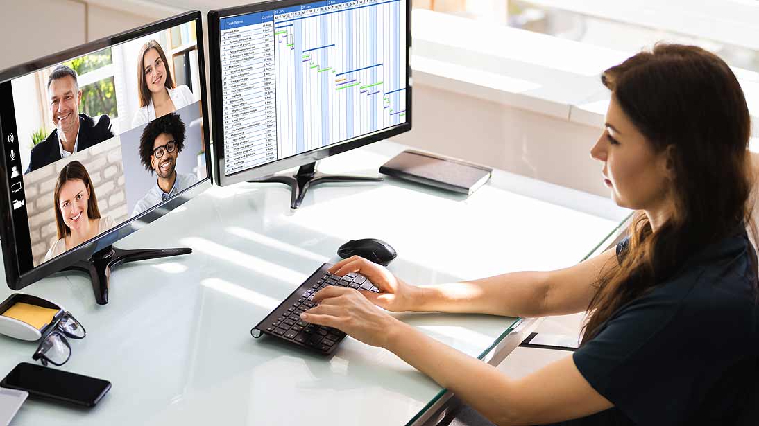 woman working at a desk on a computer