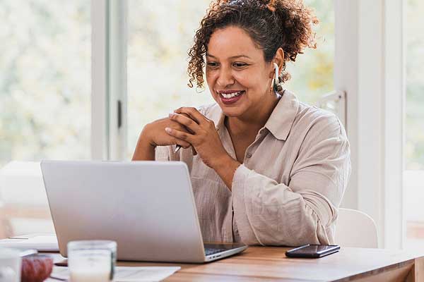 Student at home on computer in online course