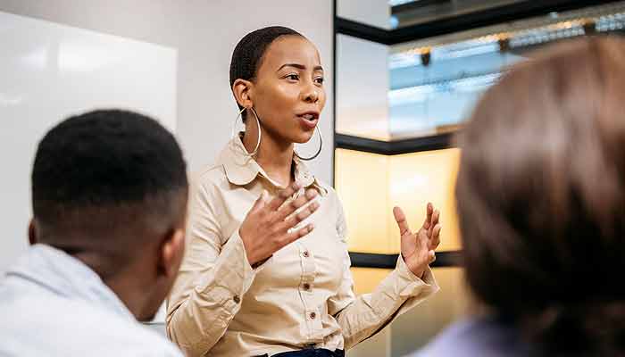 A manager presenting to her team