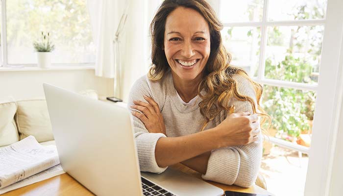 woman at a desk with a laptop