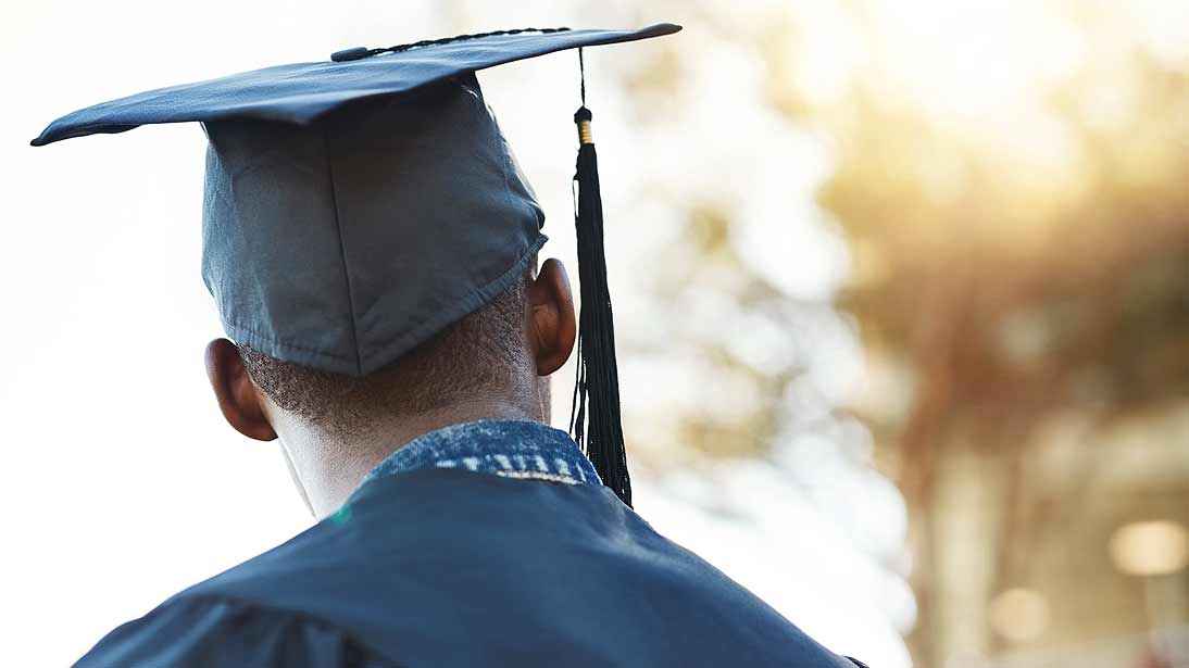 graduate in cap and gown